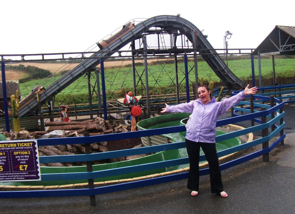 Emma standing in front of the log flume at Flambards