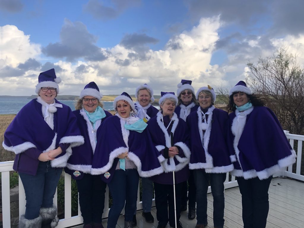 Little Bird Creative's Emma and Lesley singing with More Harmony Women's Barbershop Chorus