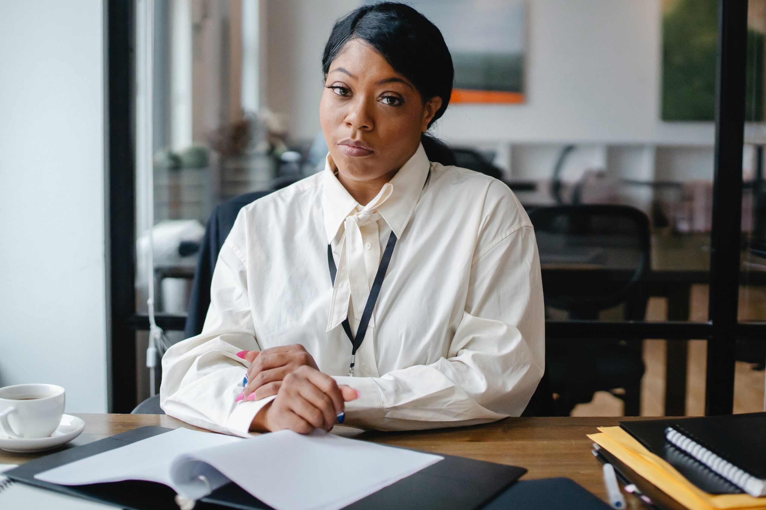 Formal lady at a desk, representing formal copywriting by Little Bird Creative