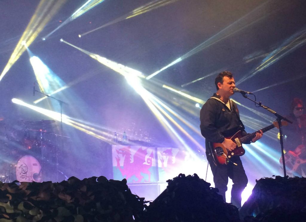 James Dean Bradfield of the Manic Street Preachers performing on stage.