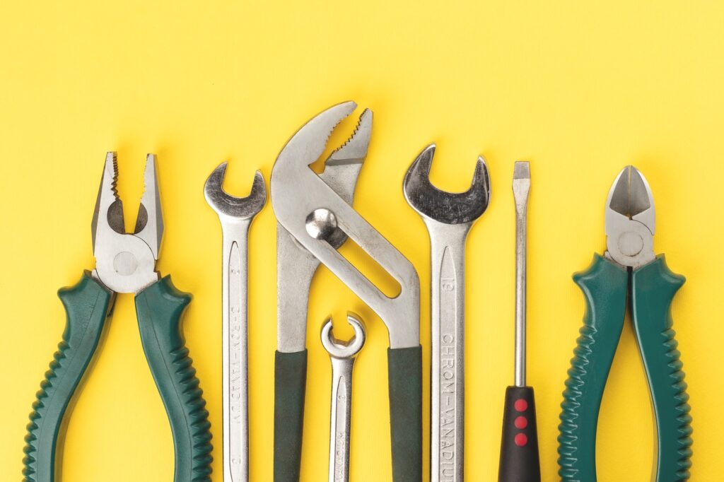 Work tools on yellow background to illustrate how to build your own website