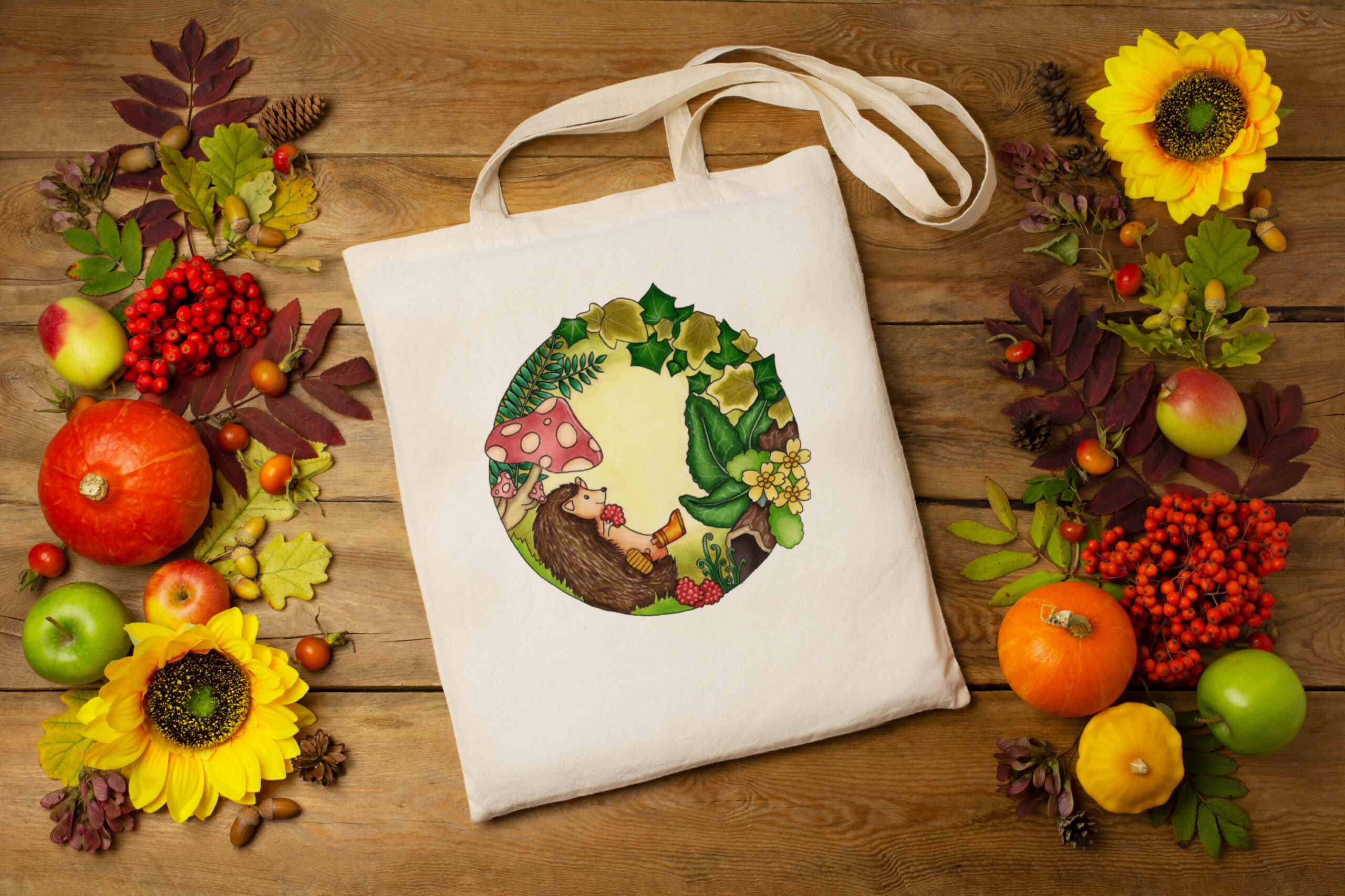 Tote bag with an illustration of a hedgehog surrounded by leaves, a unique design by Little Bird Creative, available to buy online